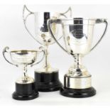 Three hallmarked silver trophies on stands, heights excluding stands 25cm, 20cm and 10cm, combined