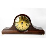 An early/mid-20th century eight-day Napoleon hat clock, the brass dial set with Roman numerals,