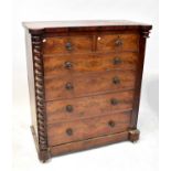 A Victorian Scottish mahogany chest of two short and four long graduating drawers flanked by