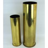 Two brass artillery shell cases comprising a 105mm, length 37cm, and a 145mm, length 50.5cm.Qty: 2