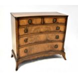 A mahogany reproduction chest of two small over three graduated drawers, with concave front and