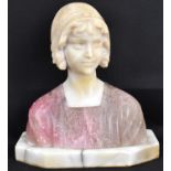 An alabaster Art Deco bust of a young lady wearing bonnet and floral fronted dress, on shaped marble