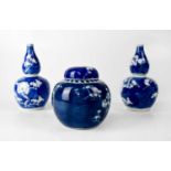 A pair of 20th century Chinese blue and white double gourd vases with prunus blossom decoration,