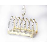 A George V hallmarked silver six-section toast rack, James Dixon & Son, Sheffield 1926, approx. 4.