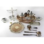 A quantity of plated ware to include a large oval tray with galleried rim and a smaller example, a