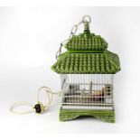 A late 20th century Chinese lamp in the form of a ceramic hanging birdhouse with steel cage,