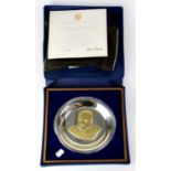 An Elizabeth II hallmarked silver plate with gold filled decoration, commemorating Winston Churchill