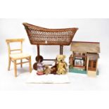 An early 20th century bassinet to wooden base and wheels, a child's small chair, four cuddly toys