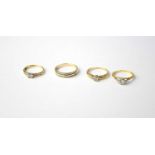 Three 9ct yellow gold rings, combined approx. 6g, and a yellow metal ring, all set with white stones