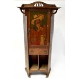 A small Arts & Crafts oak cabinet with shaped bracket top, painted cabinet door with image of a