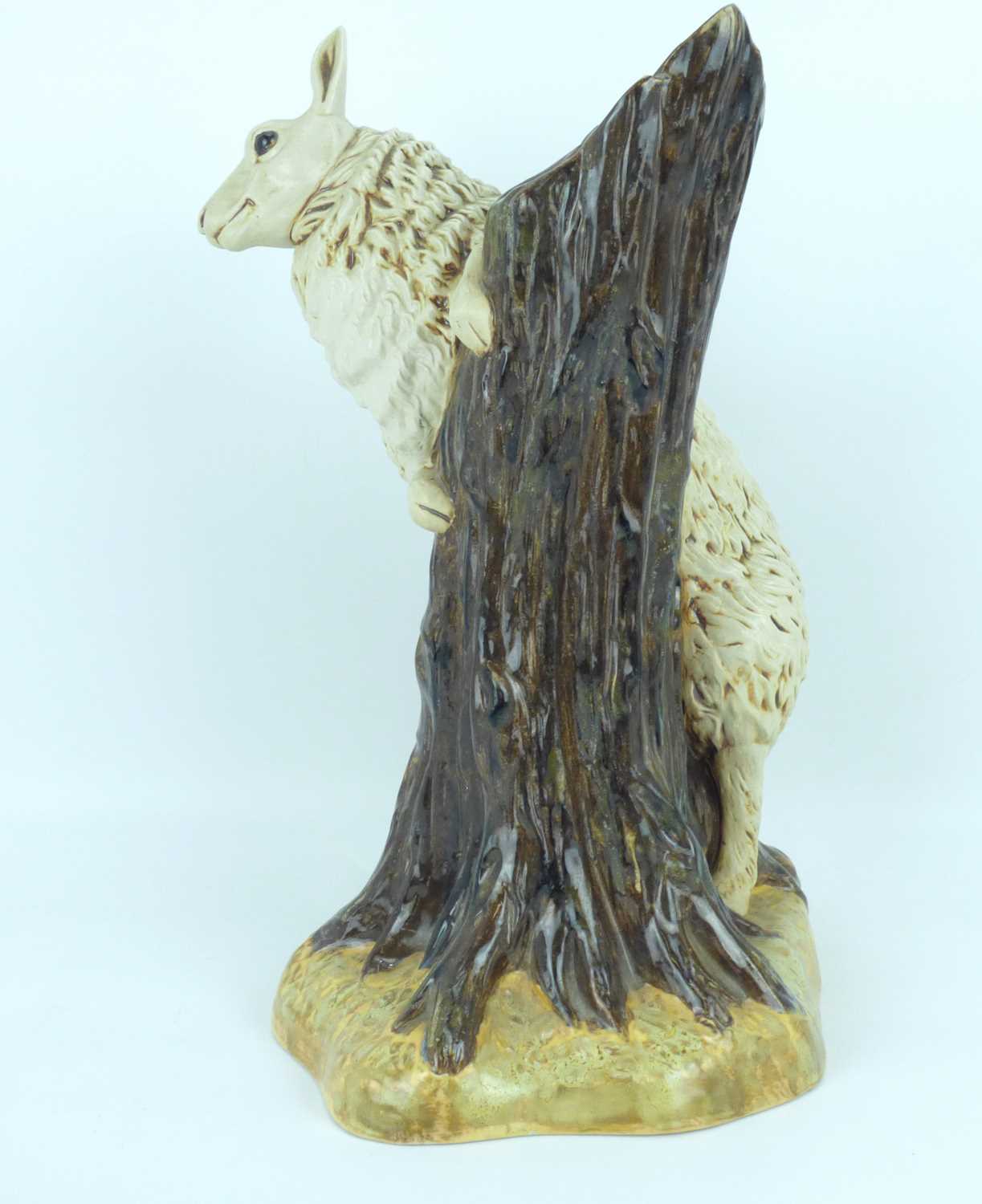 COBRIDGE POTTERY; a 'Bo Peep Sheep' pottery figure depicting a ewe on a tree stump, designed by - Image 2 of 4