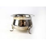 A hallmarked silver sugar bowl raised on three shell decorated feet, diameter 9cm, Birmingham