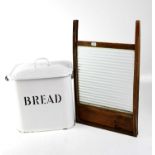 A vintage enamelled bread bin, 30 x 25 x 30cm and a glass washboard (2).