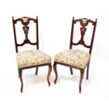 Four late 19th/early 20th century mahogany dining chairs with lyre back splats, pierced top rails
