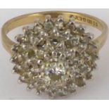 A 9ct gold diamond cluster ring in the form of a cascading cone with approximately fifty small