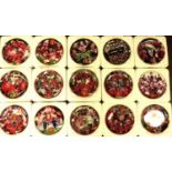 DANBURY MINT; a group of sixteen Manchester United themed collectors' plates, each with