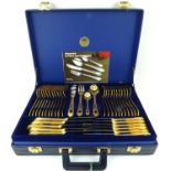 BESTECKE SOLINGEN; a seventy-piece gold plated cutlery set over two levels, to include ladles, sugar