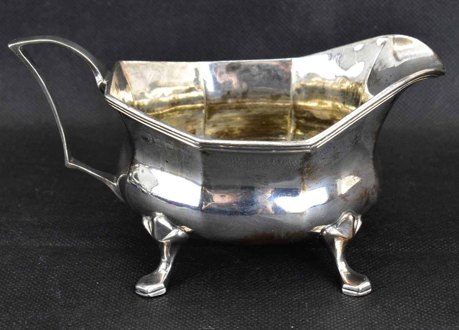 A George V hallmarked silver three-piece tea service with ebonised handle and knop, raised on four - Image 4 of 5