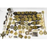 A large quantity of various horse brasses, many on leather straps, to include Masonic emblems and