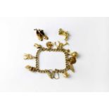 A 9ct gold charm bracelet with 9ct gold padlock catch, stamped 375, with ten charms, five hallmarked