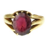 An 18ct gold claw set oval garnet ring, size P, approx. 3.8g.