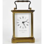 MATTHEW NORMAN, LONDON; a brass carriage clock, the white dial set with Roman numerals, with winding