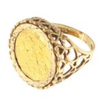 A 9ct gold ring set with a George V 1912 half sovereign, with pierced heart shoulders, size U,