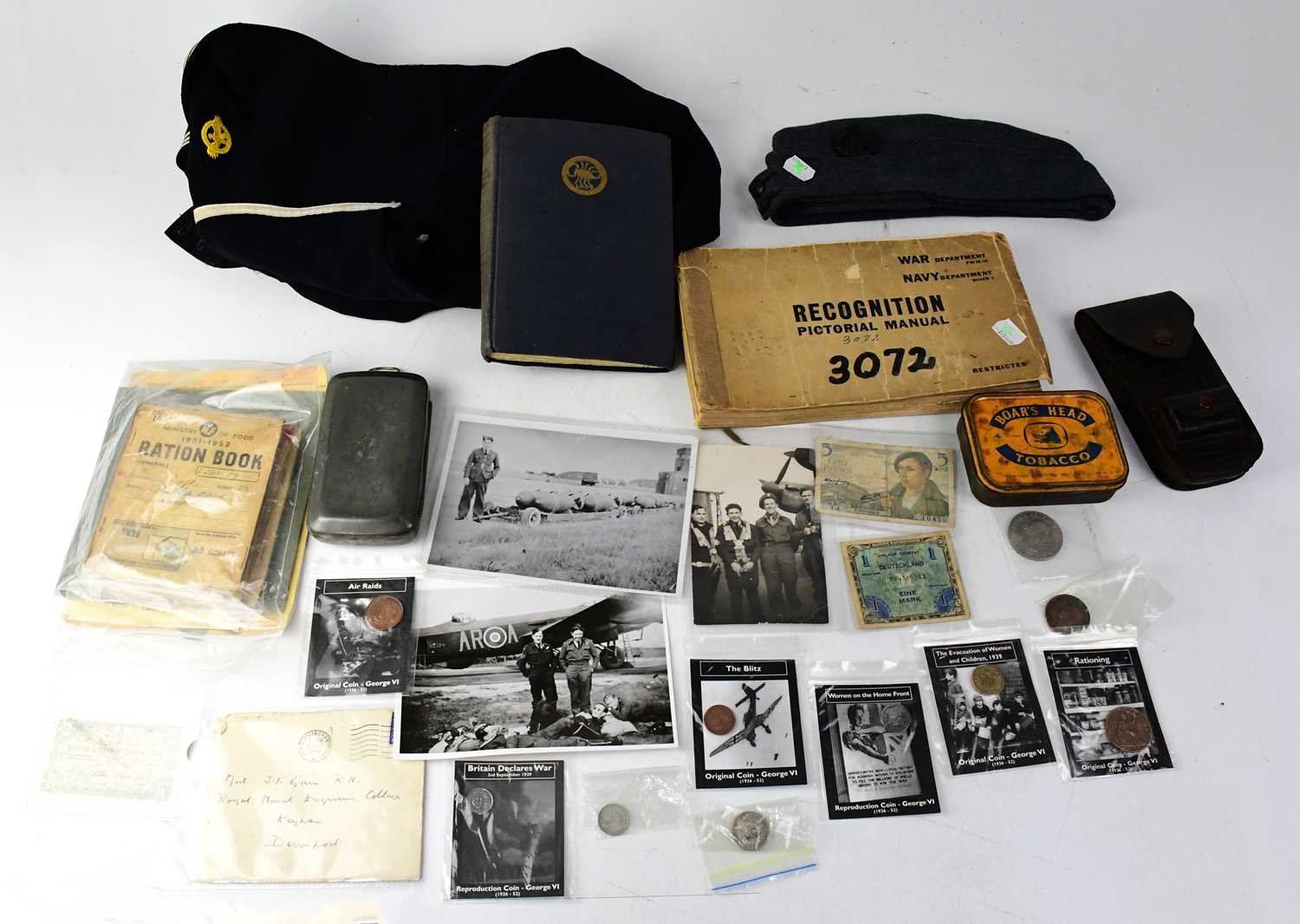 A mixed military lot to include a Royal Naval jacket, an RAF hat, a WWII Navy Department Recognition