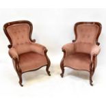 A pair of Victorian mahogany framed balloon back parlour elbow chairs with scrolling arms, shaped