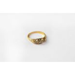 An 18ct yellow gold dress ring set with five graduated diamonds, size Q.Condition Report: Approx.