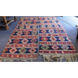 A near-matched pair of 19th century Turkish Kilim runner rugs, each comprising six horizontal