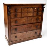 A Victorian mahogany Scottish chest of drawers, with central double drawer flanked by pair of