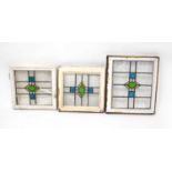 Twenty-five early 20th century stained glass windows, mostly matching square and diamond patterns,