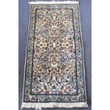 A modern Chinese rug with floral patterns and birds, on an ivory ground, 148 x 72cm.