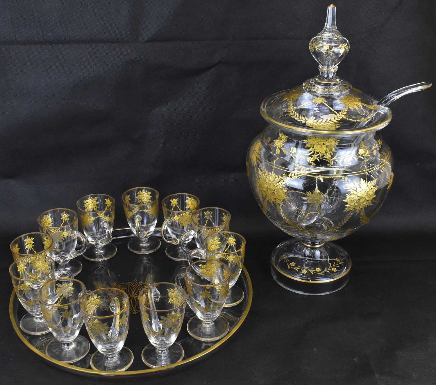 A late 19th/early 20th century lidded punch bowl, height 46cm, ladle, tray, diameter 38cm, and