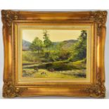 UNATTRIBUTED; an early 20th century oil on canvas, depicting cattle grazing by a pond in the