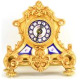 A modern French-style mantel clock of architectural design, gilt metal with blue white and floral