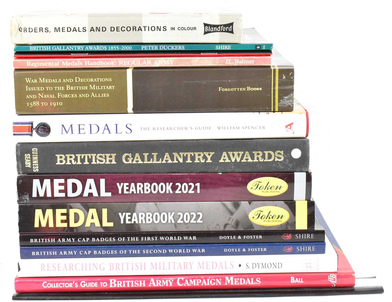 Twelve military reference books to include 'Medal Yearbook 2021-2022', 'Orders Medals and