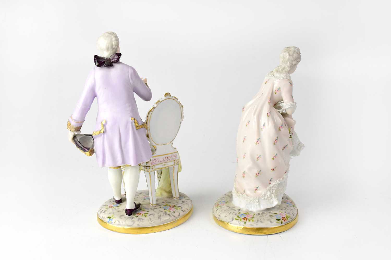 SITZENDORF; a pair of late 19th/early 20th century figures in period costume, both to oval floral - Image 2 of 3