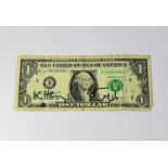 KEITH HARING; a US $1 bill bearing the artist's signature and 'Baby' doodle in black marker.