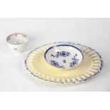 A creamware basket weave pattern oval dish with pierced and blue highlighted border, together with