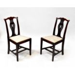 Four 19th century oak dining chairs with drop-in upholstered seats, double cross supports and square