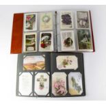 Two albums of early/mid-20th century European and British greeting cards, Birthdays, Christmas,