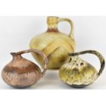 WEST GERMAN POTTERY; three ceramic jugs of squat form, two pattern no.313 with different finishes,