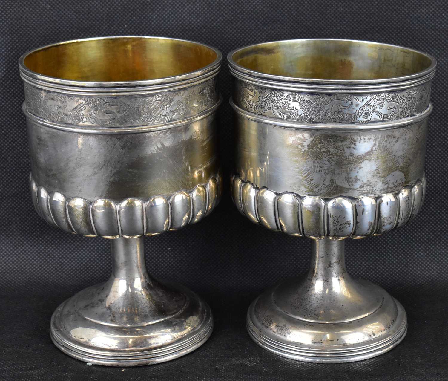 A pair of late 19th/early 20th century gilt white metal wine goblets of Renaissance style,