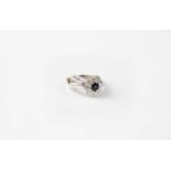 An 18ct white gold sapphire and diamond solitaire ring, stamped 750, size L1/2, approx. 4.5g.