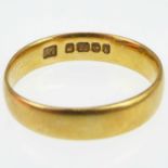 A 22ct gold band ring, size J, approx. 2.7g.