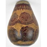 A 19th century carved coquilla nut, the body carved with fourteen peace emblems, each depicting