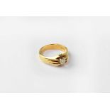 An 18ct gold solitaire diamond ring in contemporary setting, stamped 18, size S, approx. 7.1g.