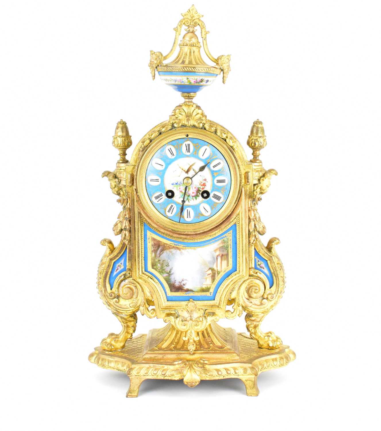 An early 20th century French-style gilt metal mantel clock, the porcelain dial set with Roman